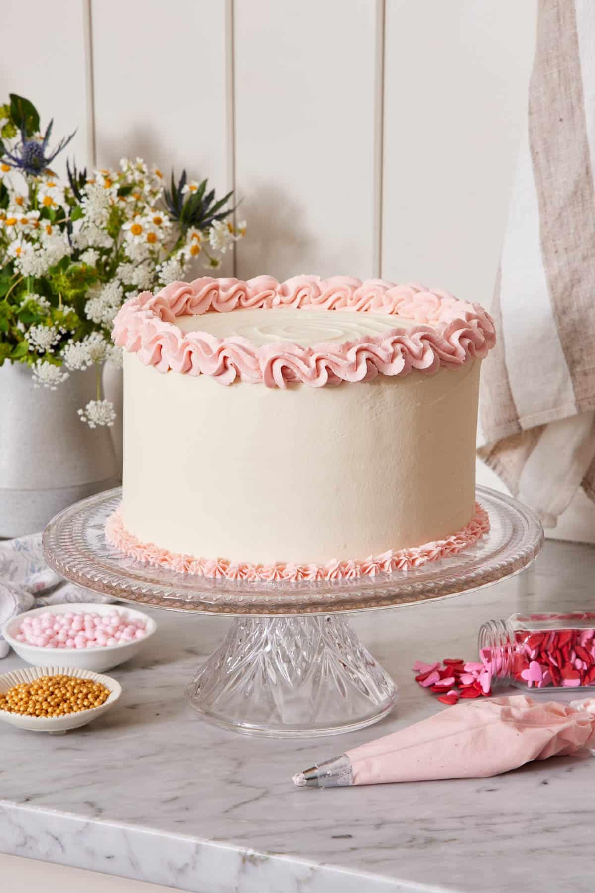 Luxurious pink velvet layer cake with smooth cream cheese frosting