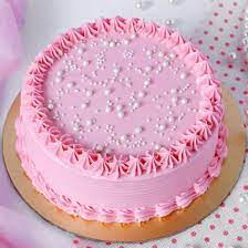 Charming pink and white cake generously covered in colorful sprinkles